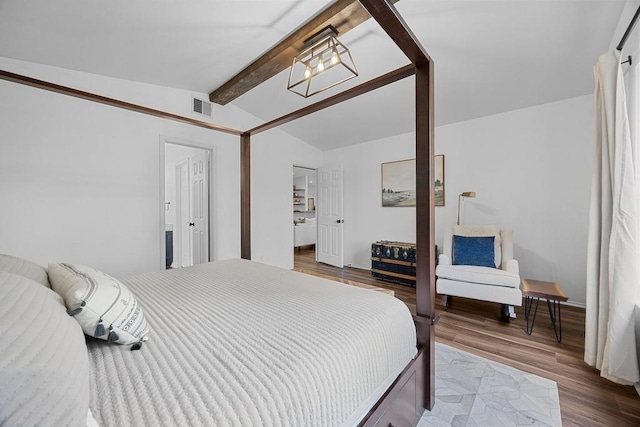 bedroom featuring dark wood-type flooring, a chandelier, and baseboards