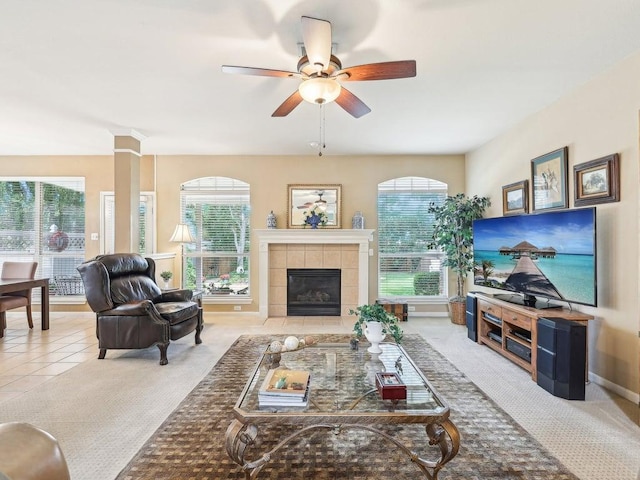 14928 Thatcher Dr, Austin, TX 78717 - living room featuring healthy amount of natural light, ceiling fan, a tile fireplace, and baseboards