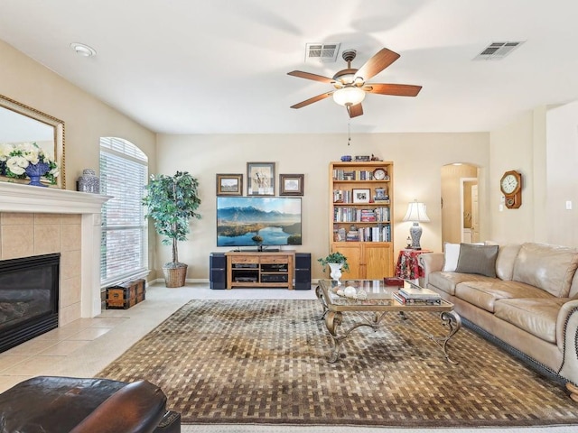 14928 Thatcher Dr, Austin, TX 78717 - living area featuring a ceiling fan, arched walkways, and a tile fireplace