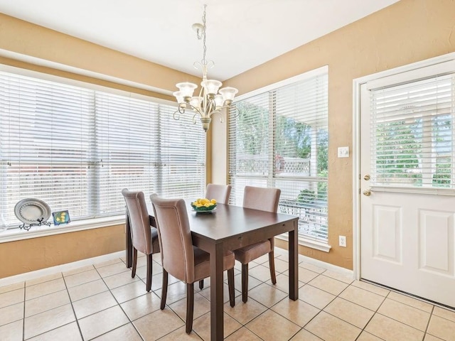 14928 Thatcher Dr, Austin, TX 78717 - dining area with a chandelier, baseboards, healthy amount of natural light, and light tile patterned floors