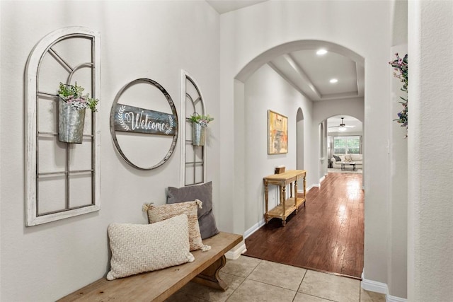240 Maeves Way, Austin, TX 78737 - hallway with arched walkways, tile patterned floors, baseboards, and recessed lighting