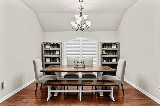 240 Maeves Way, Austin, TX 78737 - dining space featuring a chandelier, vaulted ceiling, baseboards, and wood finished floors