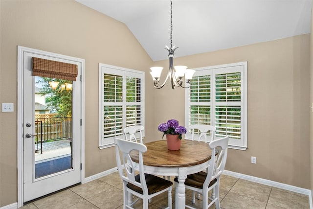 240 Maeves Way, Austin, TX 78737 - dining space featuring a chandelier, light tile patterned floors, lofted ceiling, and baseboards
