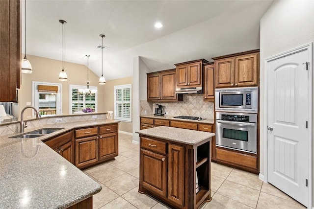 240 Maeves Way, Austin, TX 78737 - kitchen featuring stainless steel appliances, a sink, lofted ceiling, backsplash, and under cabinet range hood