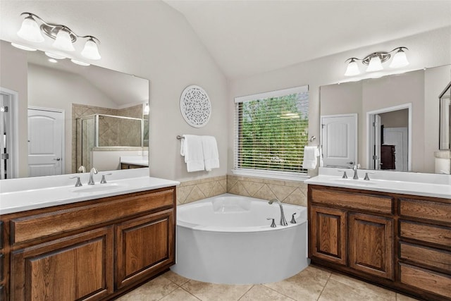 240 Maeves Way, Austin, TX 78737 - full bath with lofted ceiling, a stall shower, tile patterned floors, two vanities, and a bath