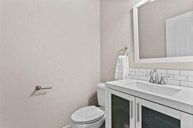 240 Maeves Way, Austin, TX 78737 - half bath with decorative backsplash, toilet, and vanity