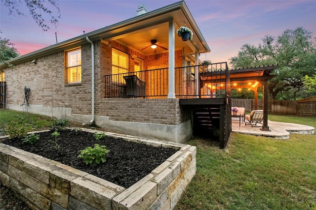 240 Maeves Way, Austin, TX 78737 - view of side of home with a patio, brick siding, and a chimney