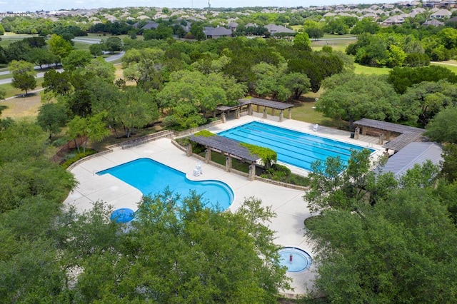 240 Maeves Way, Austin, TX 78737 - community pool with a patio and view of wooded area