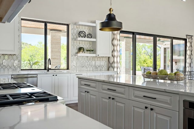 kitchen with french doors, white cabinets, and tasteful backsplash