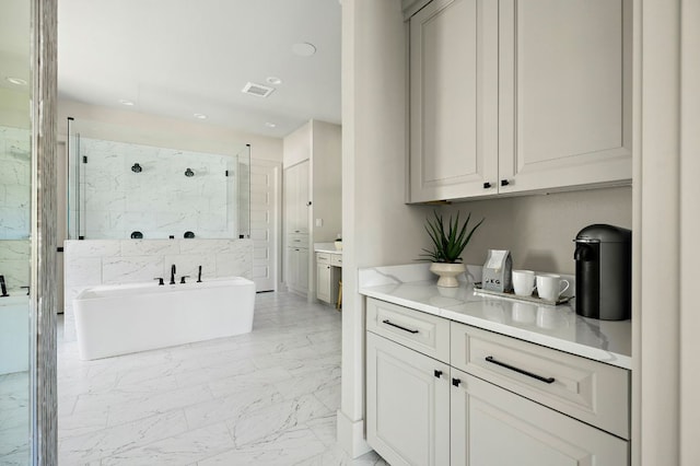 bar featuring light marble finish floors and recessed lighting