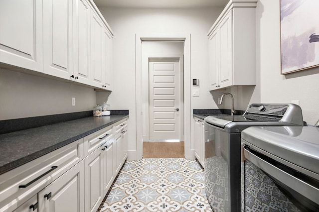 811 Wade Rd, New Braunfels, TX 78132 - washroom featuring washer and clothes dryer and cabinet space