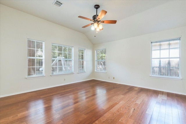 unfurnished room featuring wood-type flooring, plenty of natural light, lofted ceiling, and ceiling fan