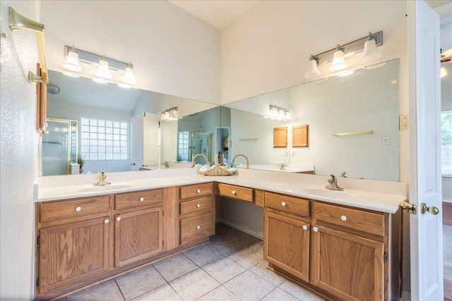full bath featuring tile patterned floors and double vanity