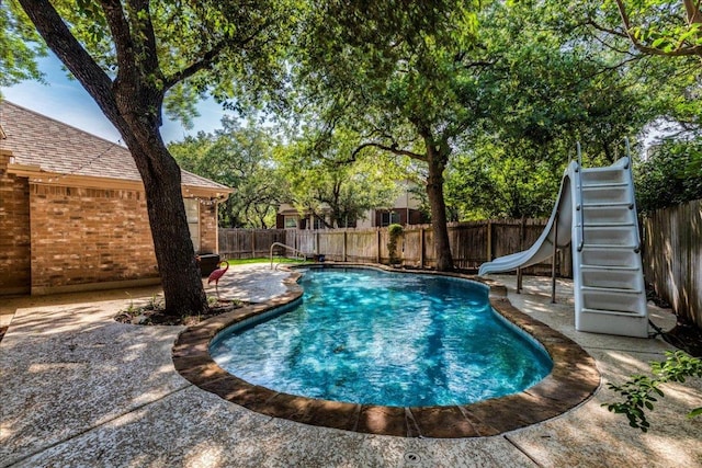 1302 Roadrunner Dr, Cedar Park, TX 78613 - view of swimming pool featuring a water slide, a fenced backyard, and a patio area