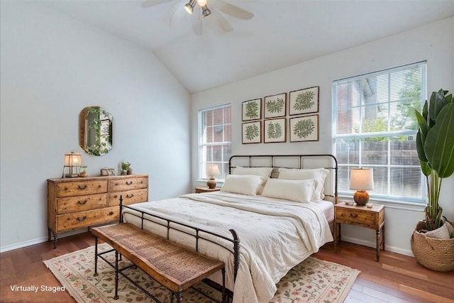 1302 Roadrunner Dr, Cedar Park, TX 78613 - bedroom with multiple windows, wood finished floors, baseboards, and lofted ceiling