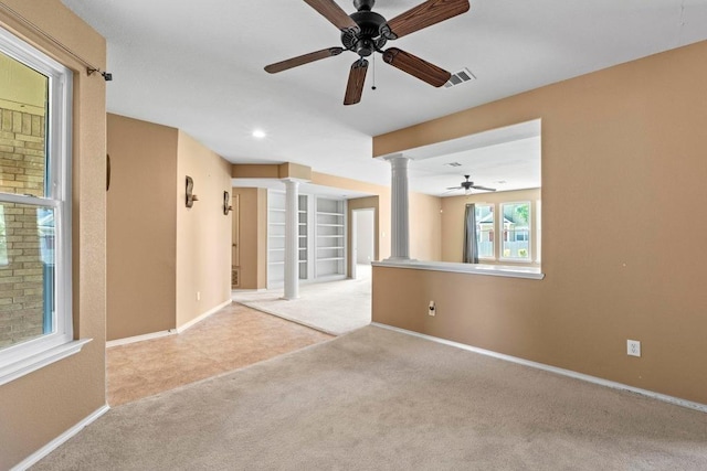 109 Silver Lace Ln, Round Rock, TX 78664 - carpeted spare room featuring decorative columns, a ceiling fan, baseboards, recessed lighting, and built in features