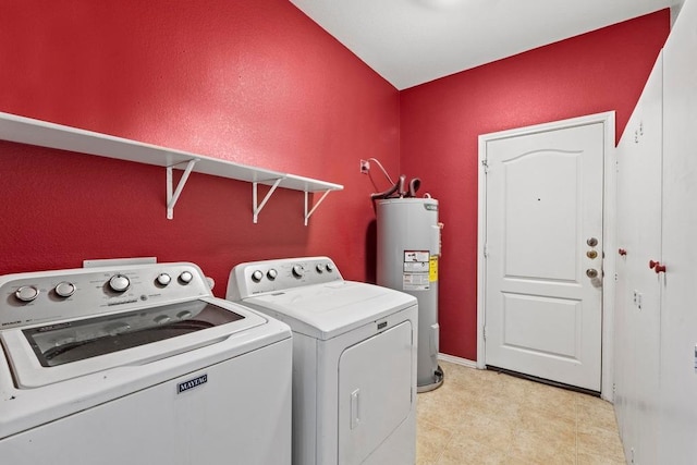 109 Silver Lace Ln, Round Rock, TX 78664 - laundry room featuring water heater, washing machine and clothes dryer, light floors, and baseboards