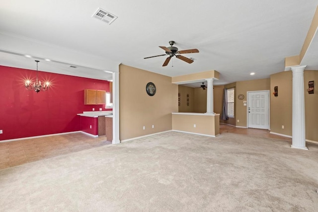 unfurnished living room with decorative columns, ceiling fan, baseboards, and carpet flooring
