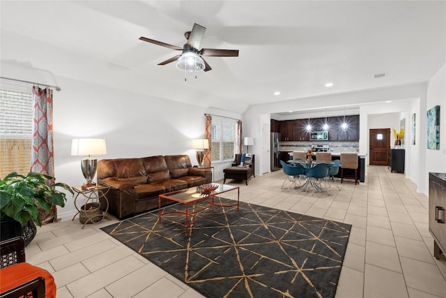 living area with light tile patterned flooring, recessed lighting, and a ceiling fan