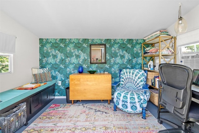 office space with wallpapered walls and an accent wall