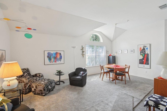 living area with vaulted ceiling, carpet, and baseboards