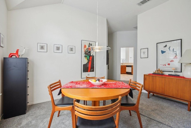 3933 Kristencreek Ln, Round Rock, TX 78681 - dining area featuring light colored carpet and vaulted ceiling