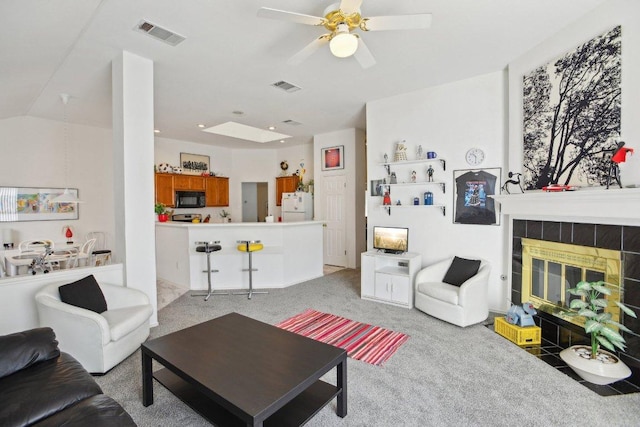 3933 Kristencreek Ln, Round Rock, TX 78681 - living room with light carpet, ceiling fan, a fireplace, and recessed lighting