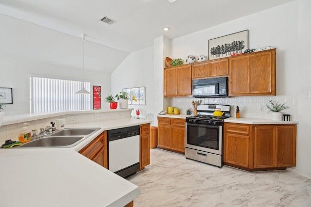 3933 Kristencreek Ln, Round Rock, TX 78681 - kitchen with black microwave, gas stove, white dishwasher, decorative backsplash, and light countertops