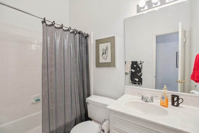 bathroom with shower / bath combo with shower curtain, vanity, and toilet