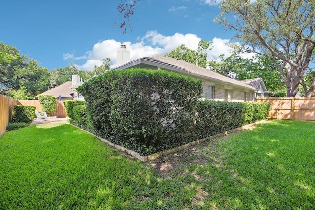 3933 Kristencreek Ln, Round Rock, TX 78681 - view of side of property with a fenced backyard and a chimney