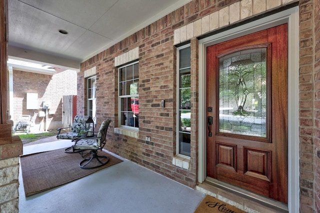 426 Valona Loop, Round Rock, TX 78681 - property entrance featuring covered porch and brick siding