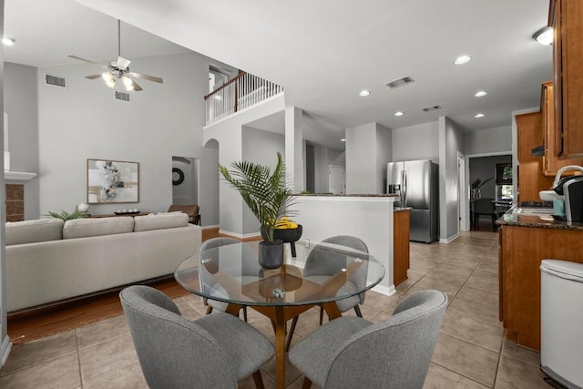 426 Valona Loop, Round Rock, TX 78681 - dining space with ceiling fan, arched walkways, light tile patterned floors, and recessed lighting
