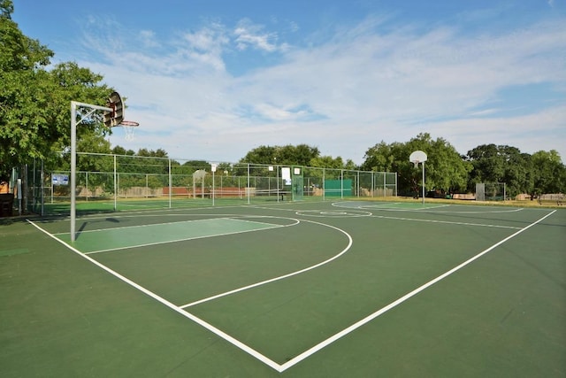 view of basketball court with community basketball court and fence