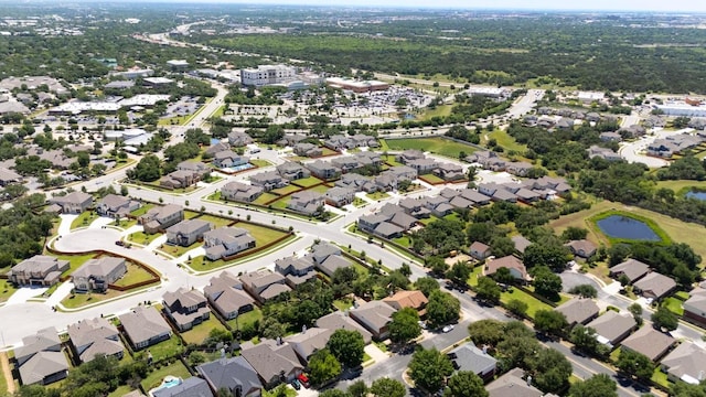 aerial overview of property's location with nearby suburban area and a large body of water