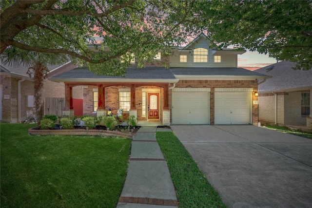 426 Valona Loop, Round Rock, TX 78681 - view of front of property featuring concrete driveway, brick siding, a porch, and a garage