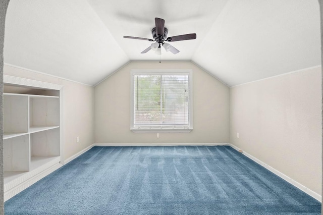additional living space featuring carpet flooring, lofted ceiling, baseboards, and a ceiling fan