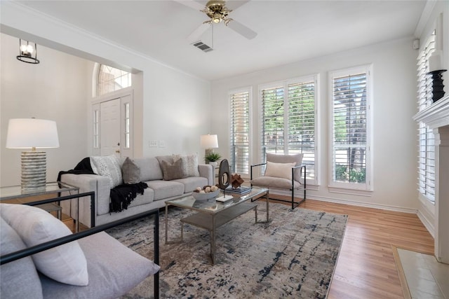 3007 Sesbania Dr, Austin, TX 78748 - living area featuring wood finished floors, ornamental molding, ceiling fan, and baseboards