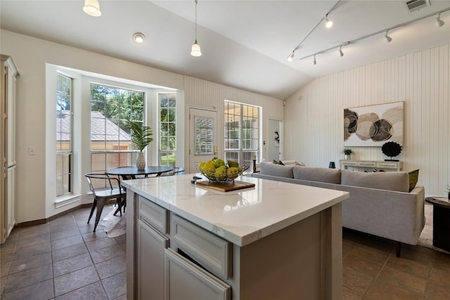 3007 Sesbania Dr, Austin, TX 78748 - kitchen featuring healthy amount of natural light, lofted ceiling, open floor plan, and a center island