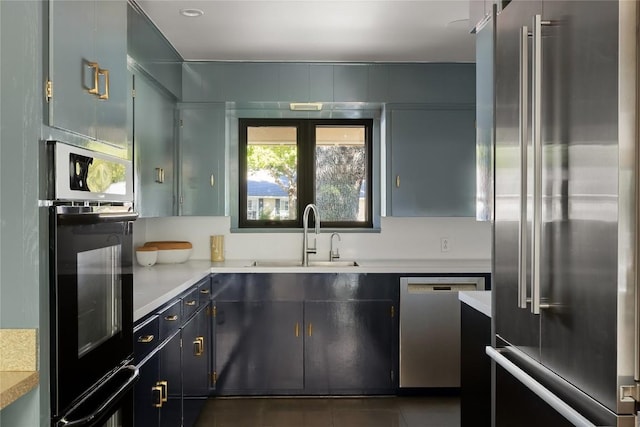 4504 Erin Ln, Austin, TX 78756 - kitchen with stainless steel appliances, a sink, light countertops, and tile patterned flooring