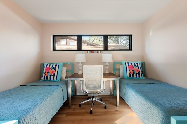 4504 Erin Ln, Austin, TX 78756 - bedroom featuring multiple windows and wood finished floors
