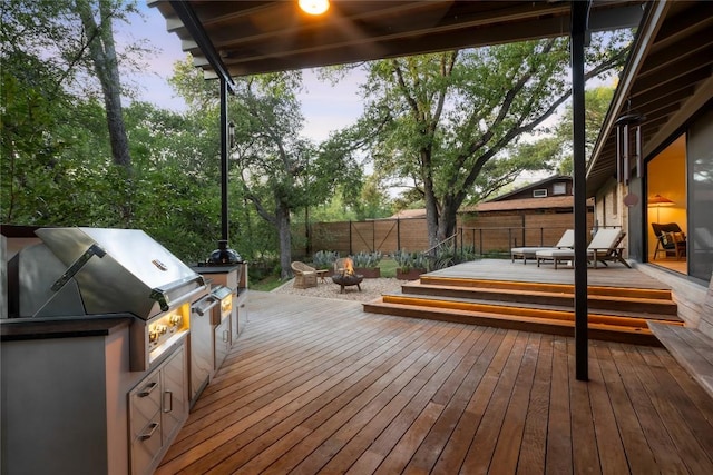 4504 Erin Ln, Austin, TX 78756 - deck with an outdoor fire pit, a fenced backyard, and grilling area
