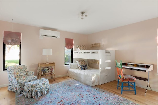 4504 Erin Ln, Austin, TX 78756 - bedroom featuring a wall mounted AC, wood finished floors, and baseboards