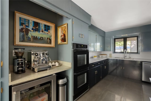 4504 Erin Ln, Austin, TX 78756 - kitchen featuring a sink, wine cooler, light countertops, dishwasher, and tile patterned flooring