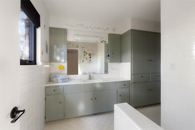 4504 Erin Ln, Austin, TX 78756 - bathroom with tile patterned floors, tile walls, and vanity