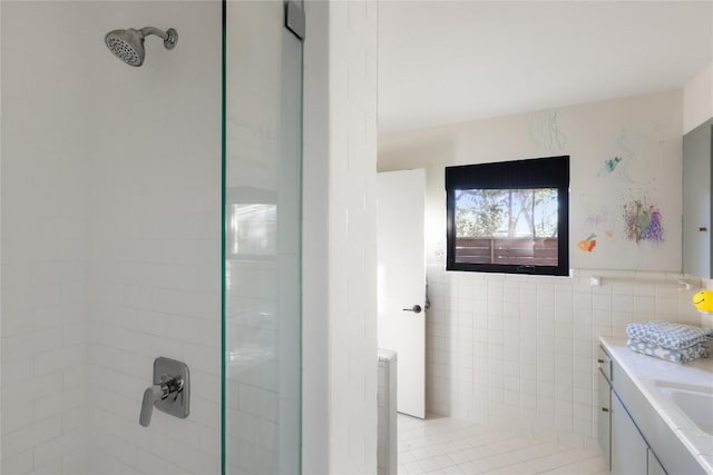 4504 Erin Ln, Austin, TX 78756 - full bathroom with tiled shower, tile walls, vanity, and wainscoting