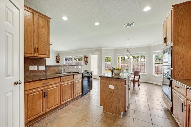 kitchen with black appliances, a sink, ornamental molding, backsplash, and recessed lighting