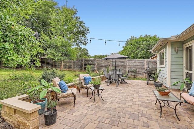 7605 Clydesdale Dr, Austin, TX 78745 - fenced backyard featuring a patio area, outdoor dining space, and grilling area
