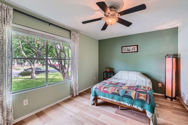 7605 Clydesdale Dr, Austin, TX 78745 - bedroom featuring light wood-style floors and a ceiling fan
