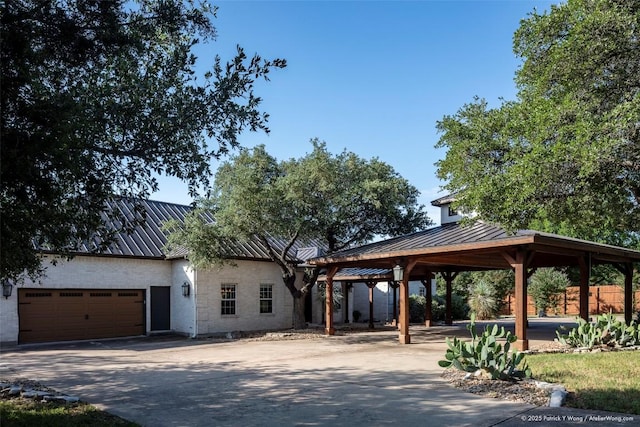 14305 Fallen Timber Dr, Austin, TX 78734 - view of front of property featuring a standing seam roof, driveway, metal roof, and a gazebo