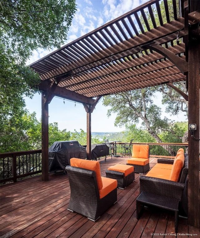 wooden terrace featuring a pergola, area for grilling, and outdoor lounge area